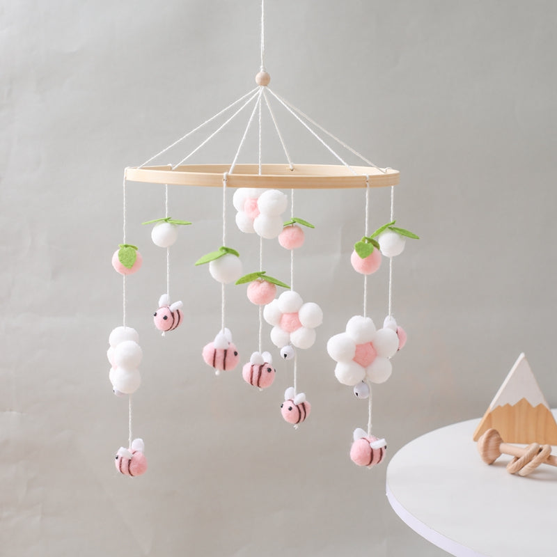 mobile bébé abeilles roses fleurs table