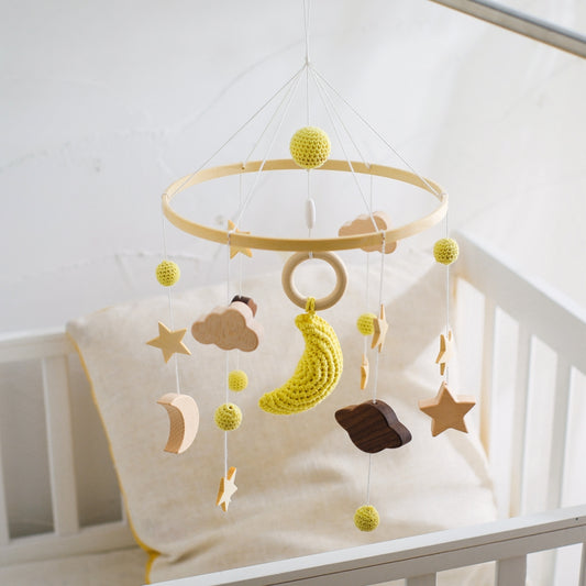mobile bébé pour lit banane coussin