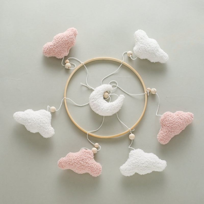 mobile lit bébé céleste nuage rose pose