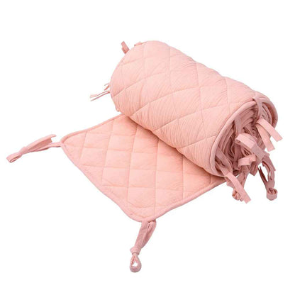 tour de lit pour bebe rose enroule